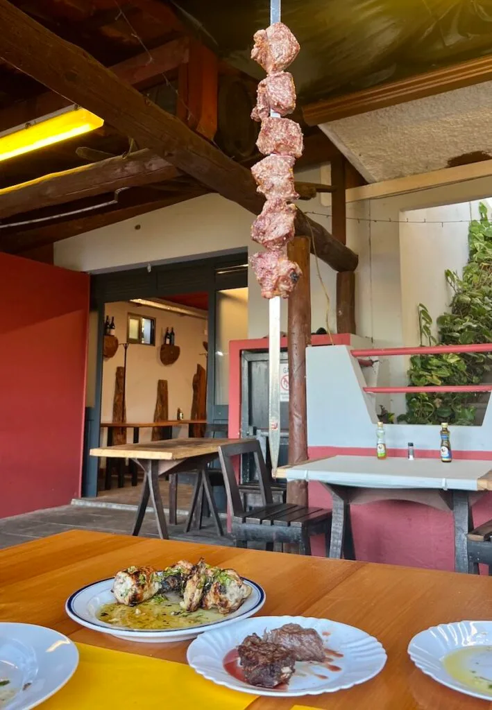 Beef chunks hang from a hook at Churrascaria Brasa Viva restaurant.