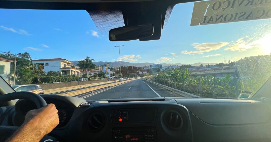 View out of a tour minivan along a main road in Madeira.
