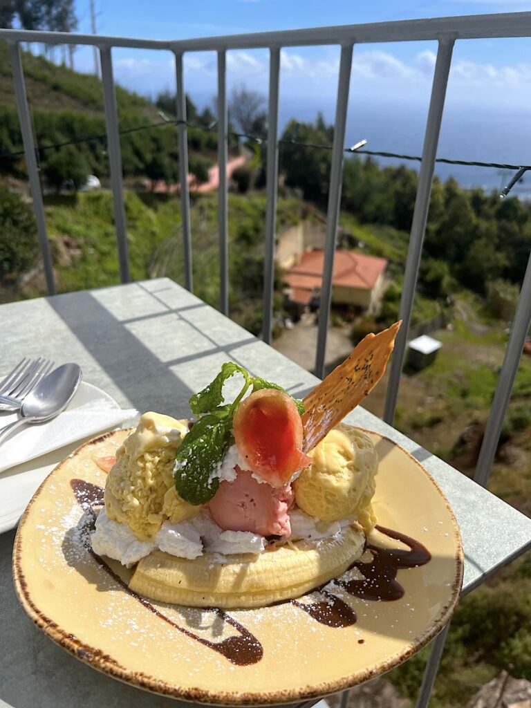 A banana split with vanilla and strawberry ice cream and cream, served at Pátio das Babosas in Monte, Madeira.