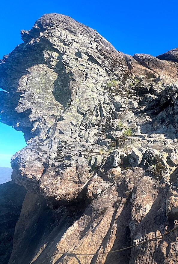 Steep rocky section of the Pico Grande trail with exposed terrain and scrambling route.